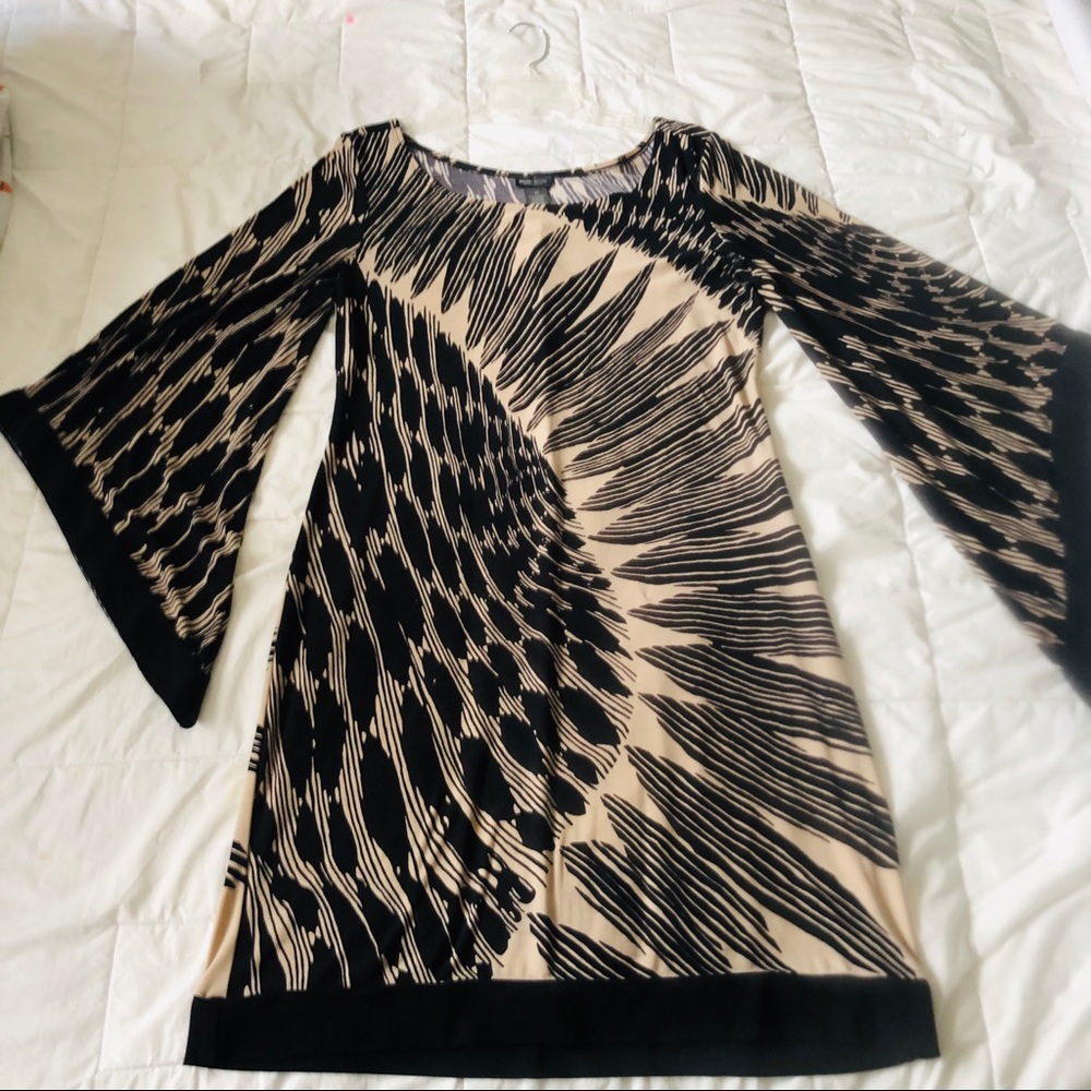 Bison Bisou mid length flare sleeved dress.